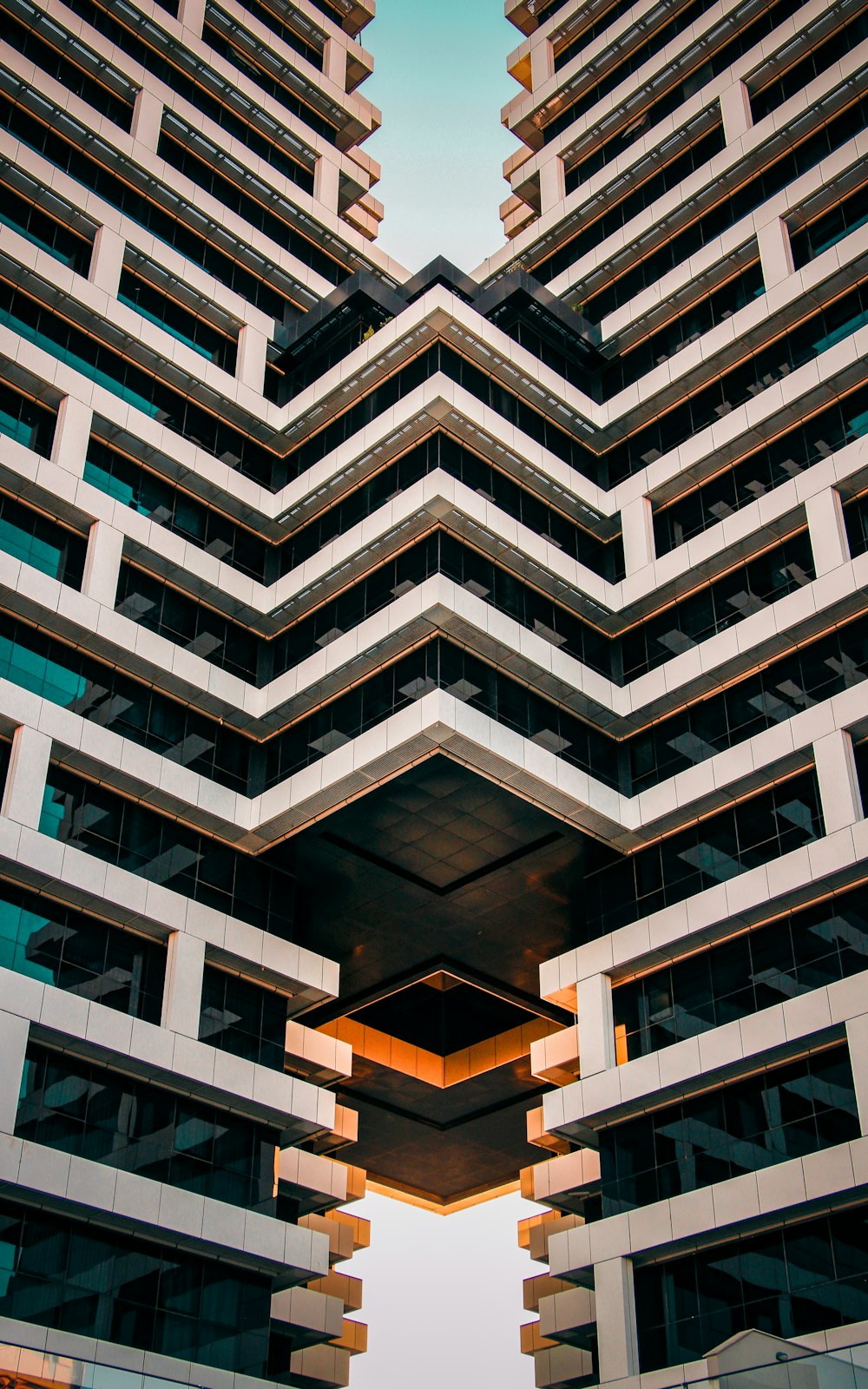 a very tall building with many windows and balconies