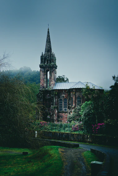 an old building with a steeple in the background