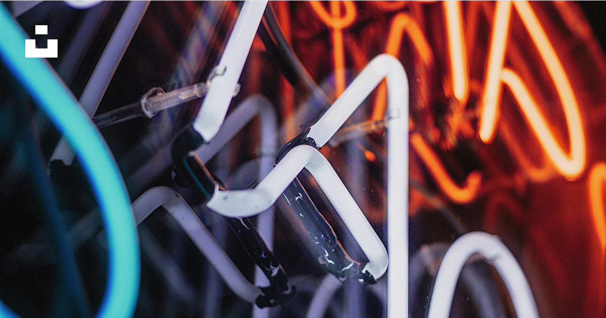 A close up of a neon sign on a wall photo – Free Abstract Image on Unsplash