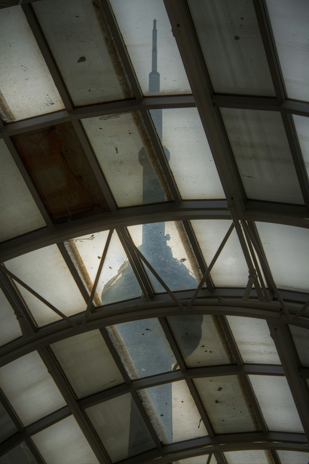 a view of a clock tower from inside a building