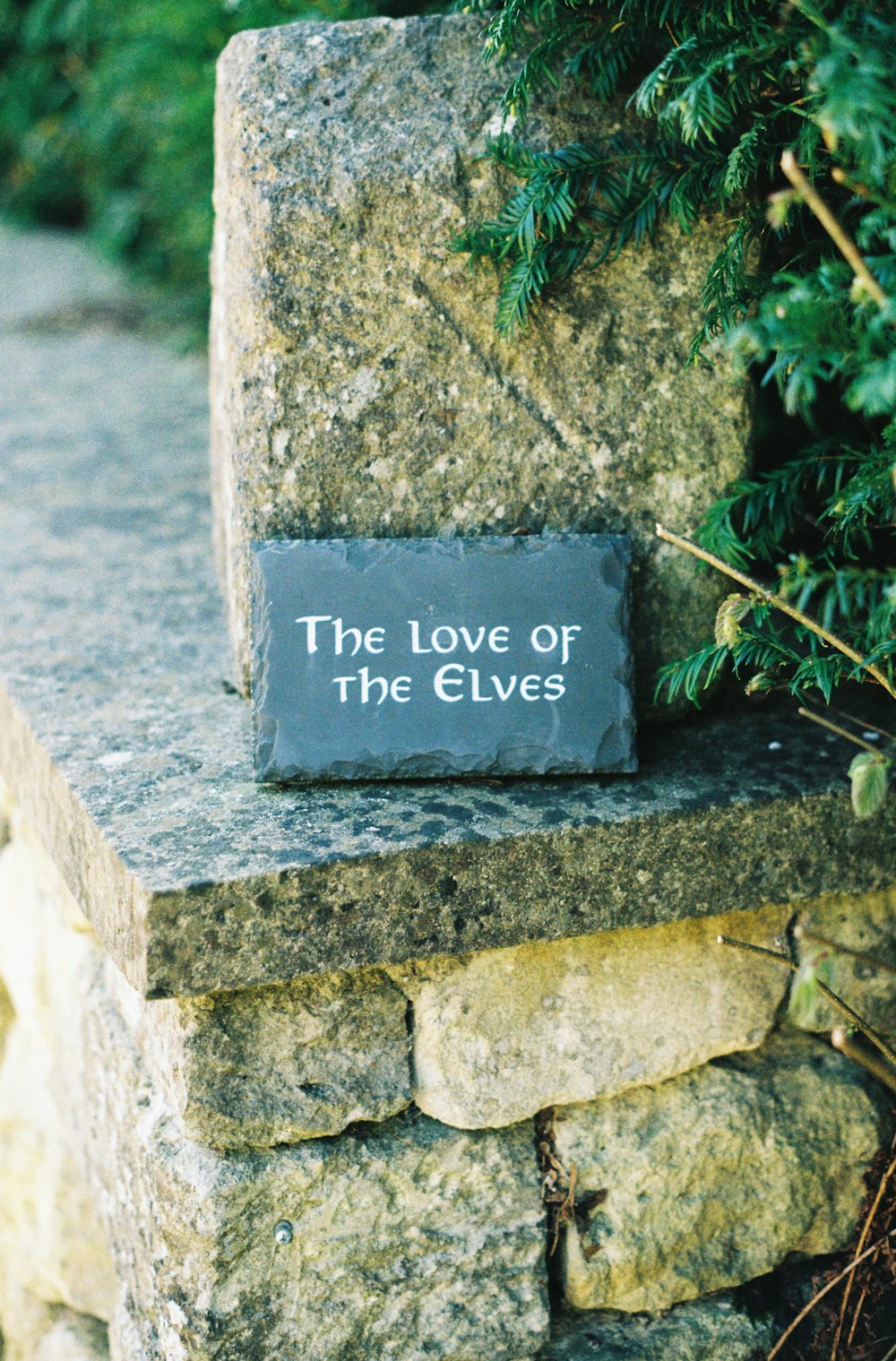 a stone monument with a plaque that reads the love of the elves