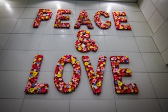 the words peace and love are made out of flowers