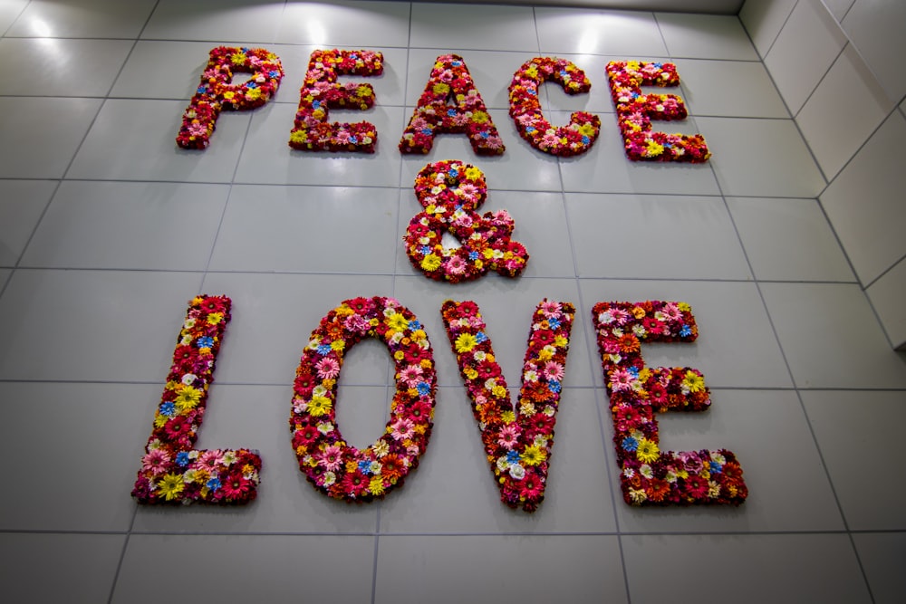 the words peace and love are made out of flowers