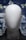 a white mannequin's head in front of a cityscape