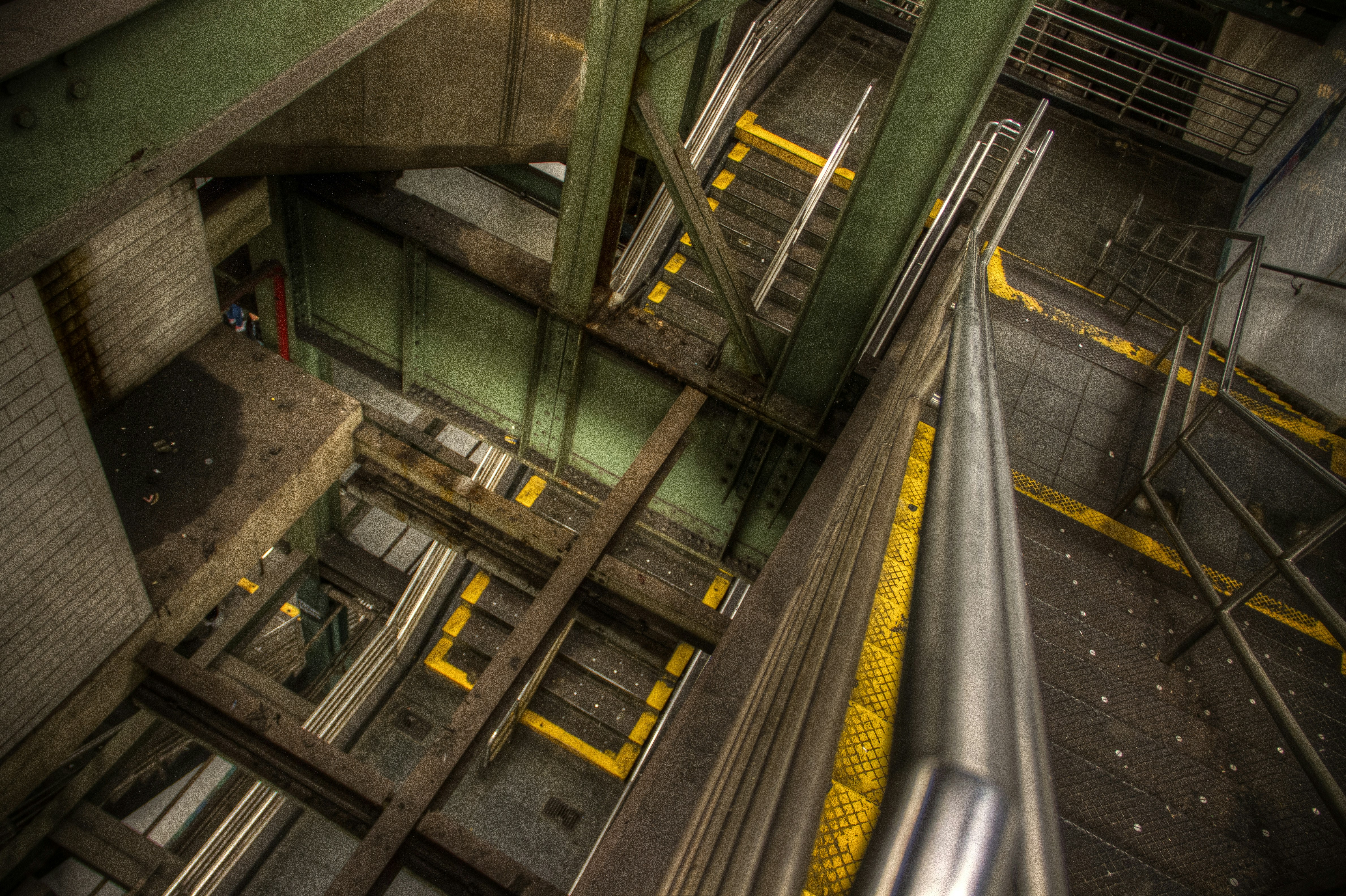 an overhead view of a building with stairs and railings