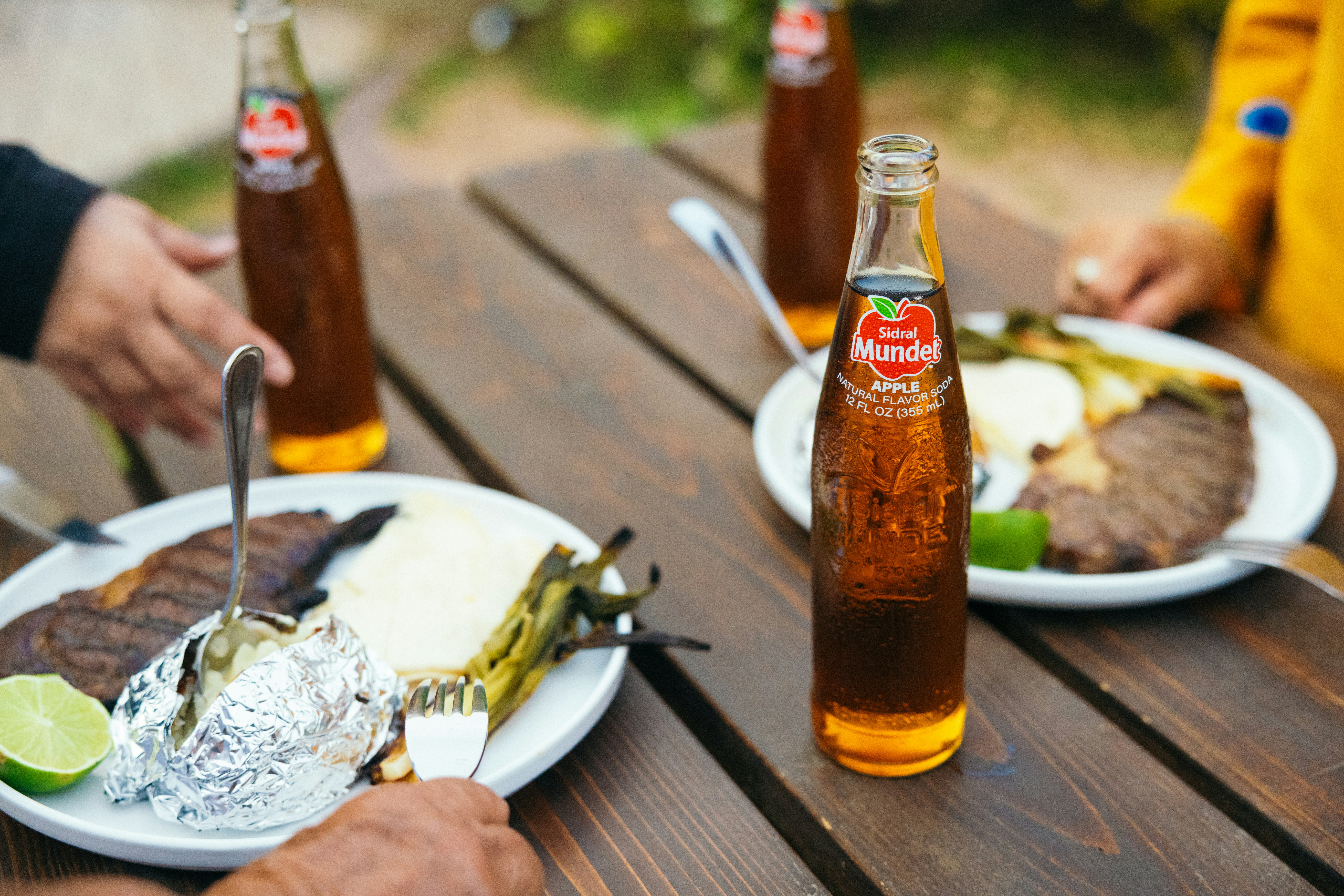 Various Australian craft beer bottles on a wooden table