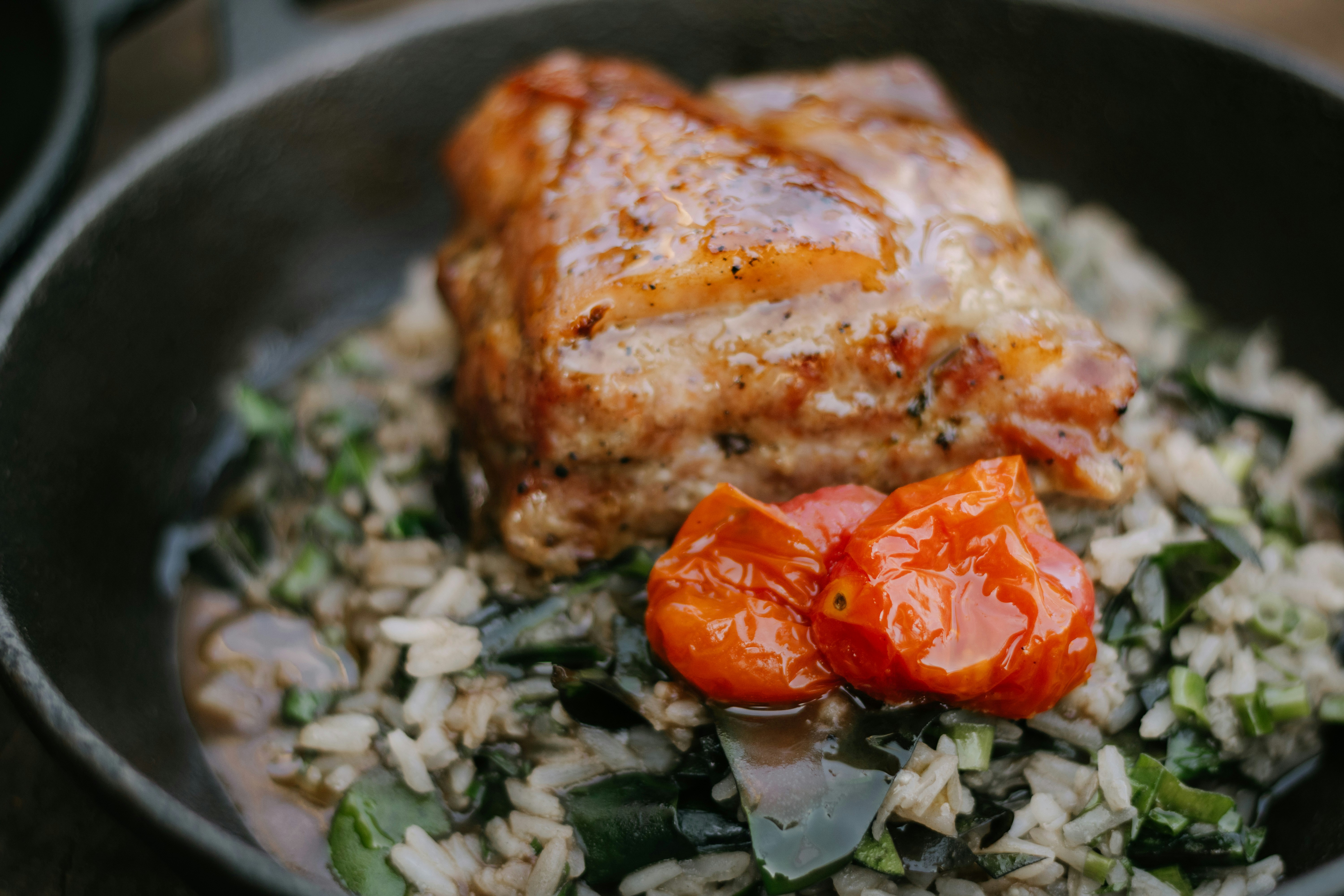 a close up of a plate of food with meat and rice