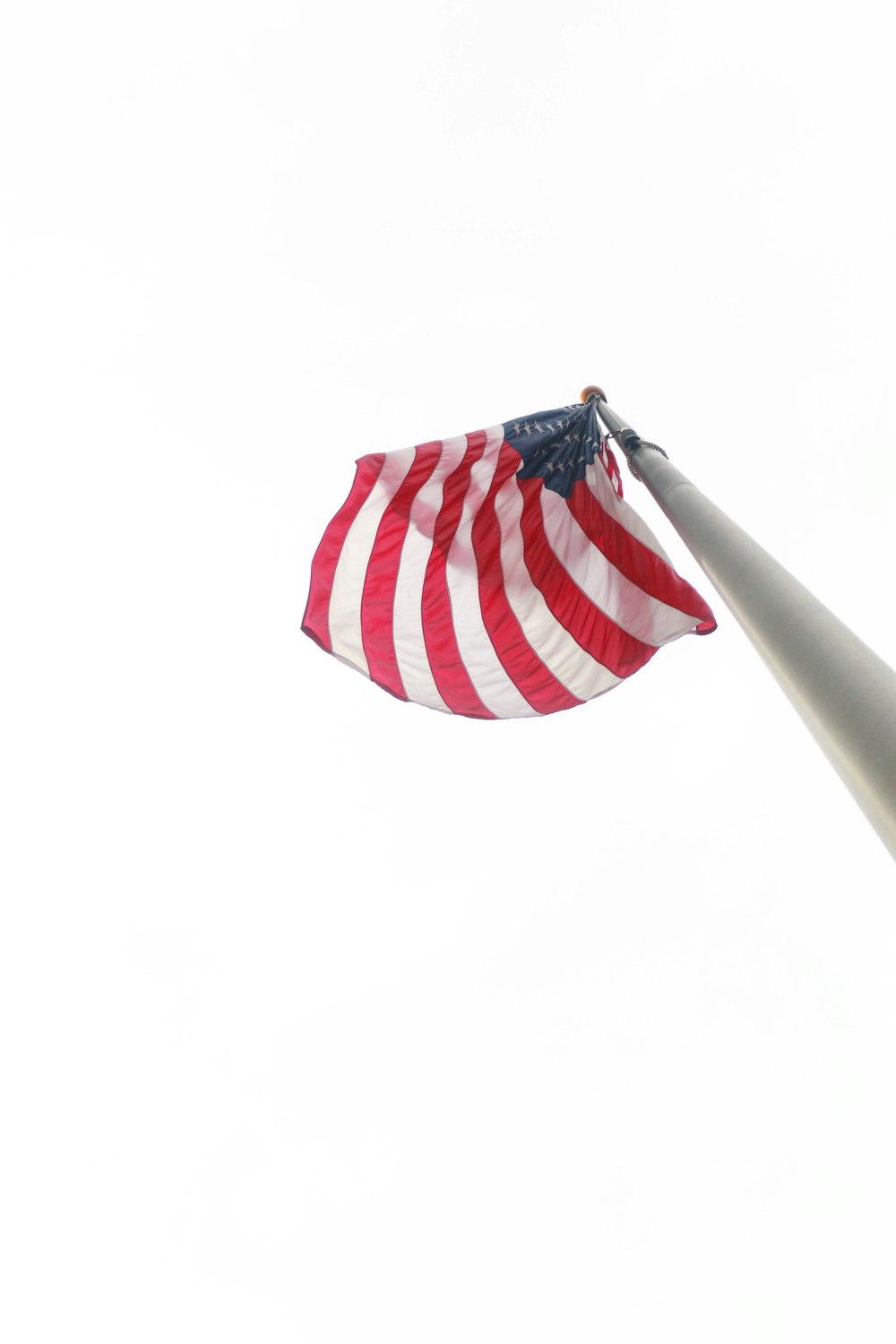 an american flag blowing in the wind