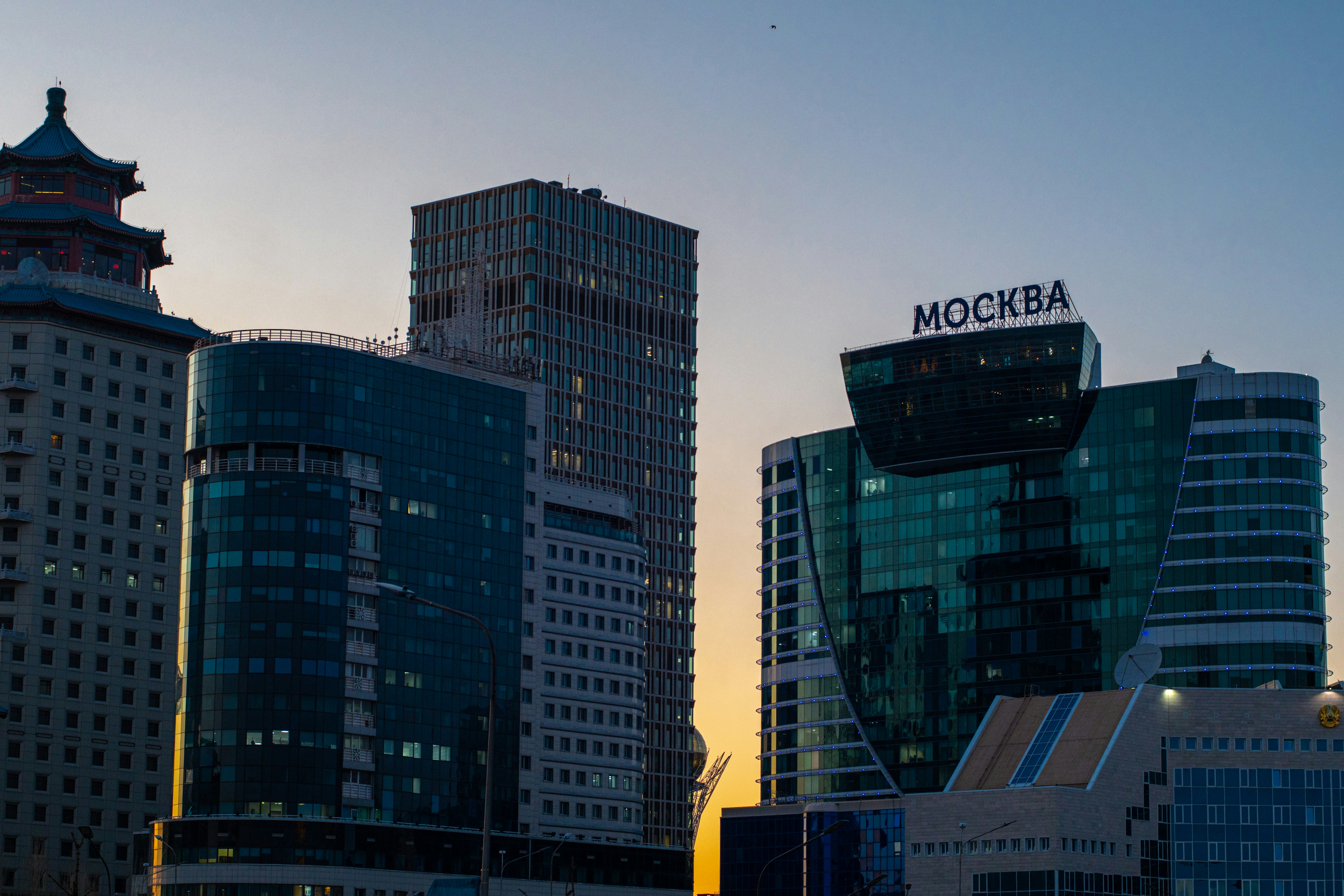 a group of tall buildings sitting next to each other