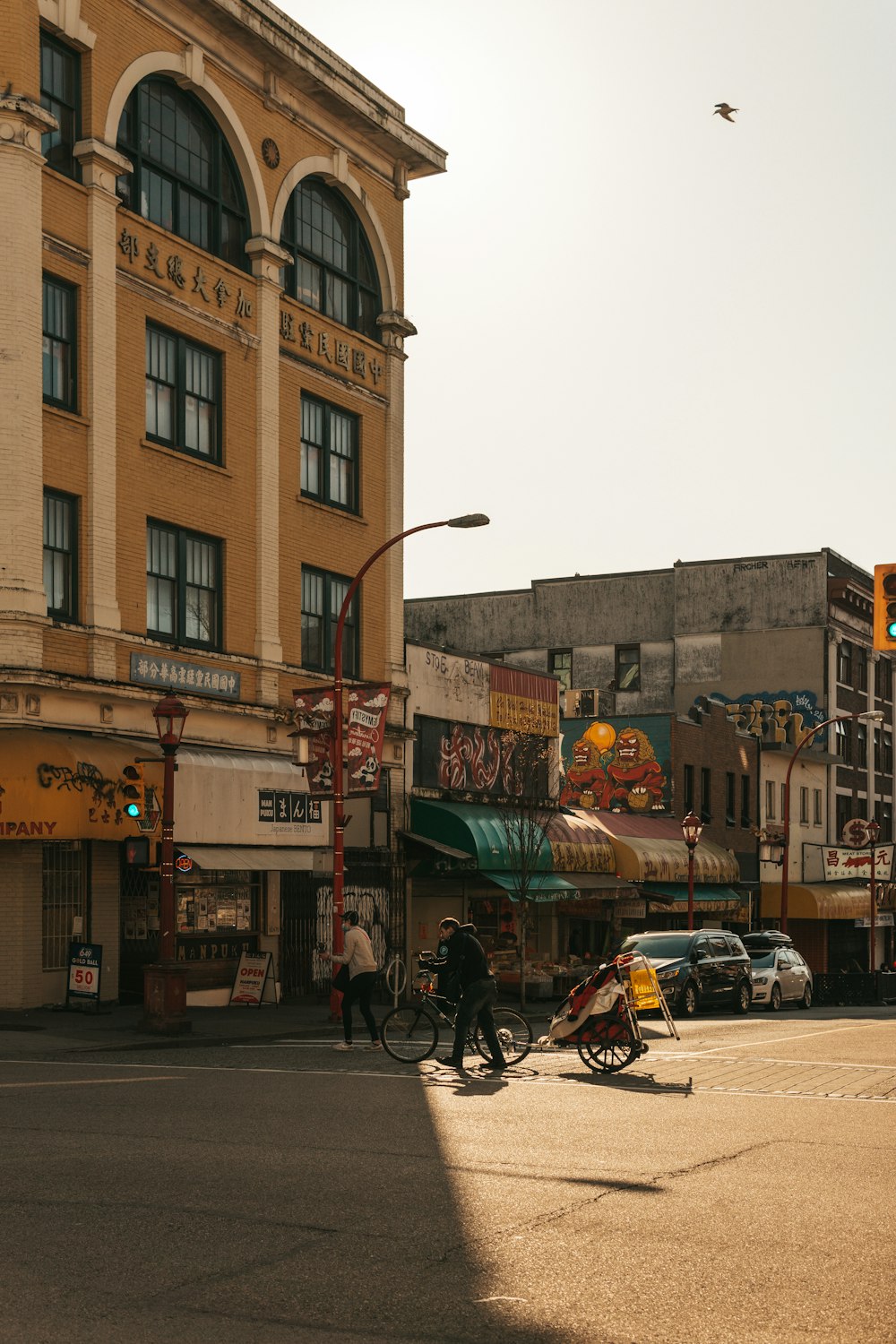 a person riding a bike on a city street