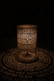 a lit candle sitting on top of a table