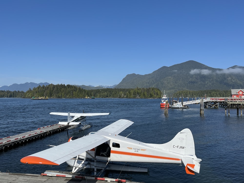 a small plane is parked on the water