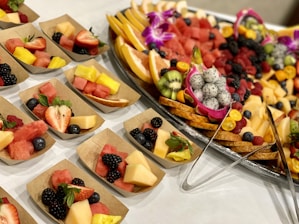 a table topped with lots of different types of fruit