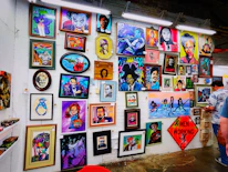 A vibrant gallery wall filled with colorful video thumbnails and photos.
