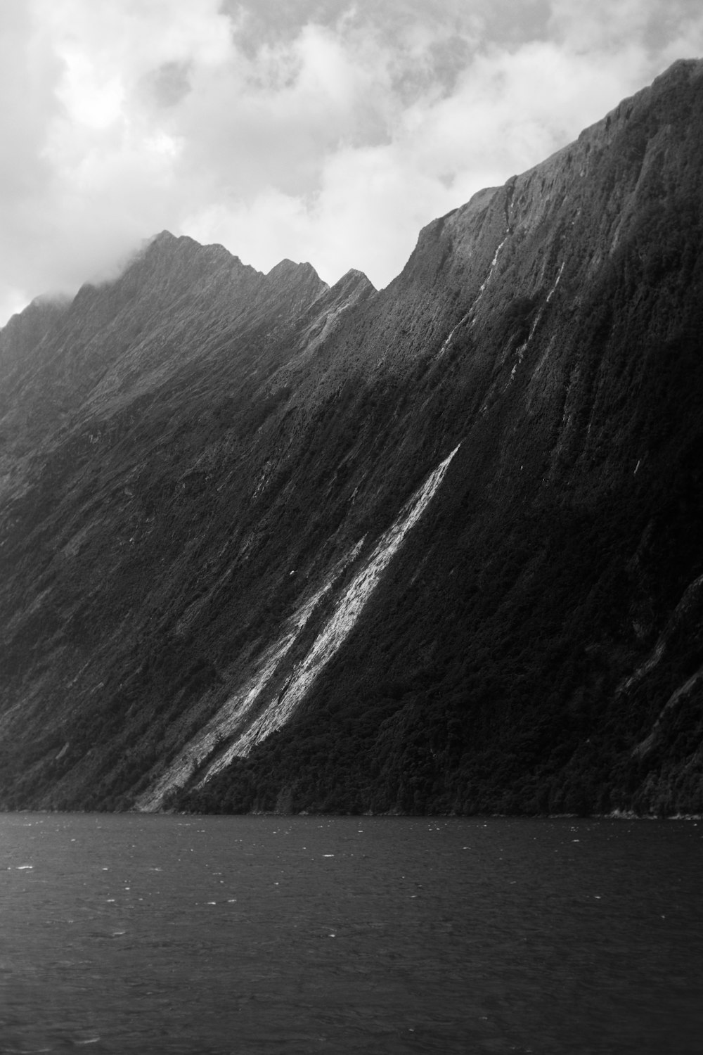 a black and white photo of a mountain range