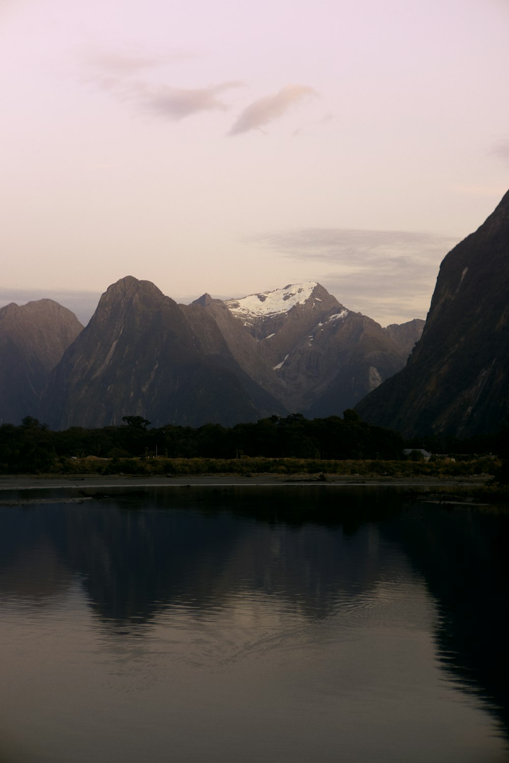 a lake with mountains in the background