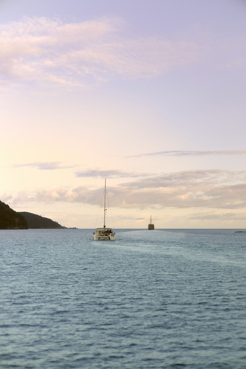 two boats are out in the open water