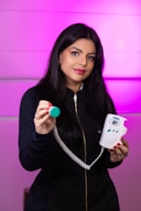 a woman holding a remote control in her hand