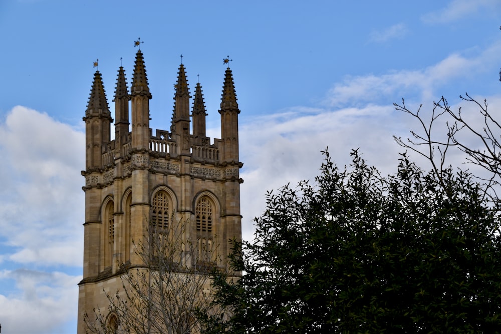 a very tall tower with a clock on it's side