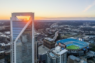 an aerial view of a city at sunset
