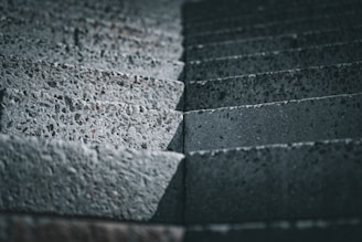 a close up of a brick wall made of cement