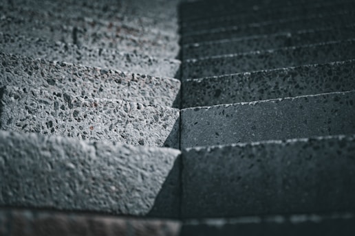 a close up of a brick wall made of cement