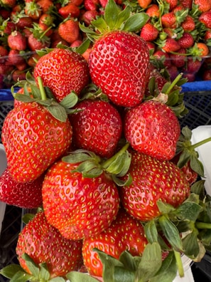 a pile of strawberries sitting on top of each other