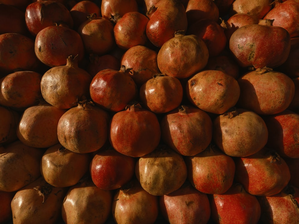 a pile of pomegranates sitting on top of each other