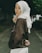 a woman in a hijab standing on a street