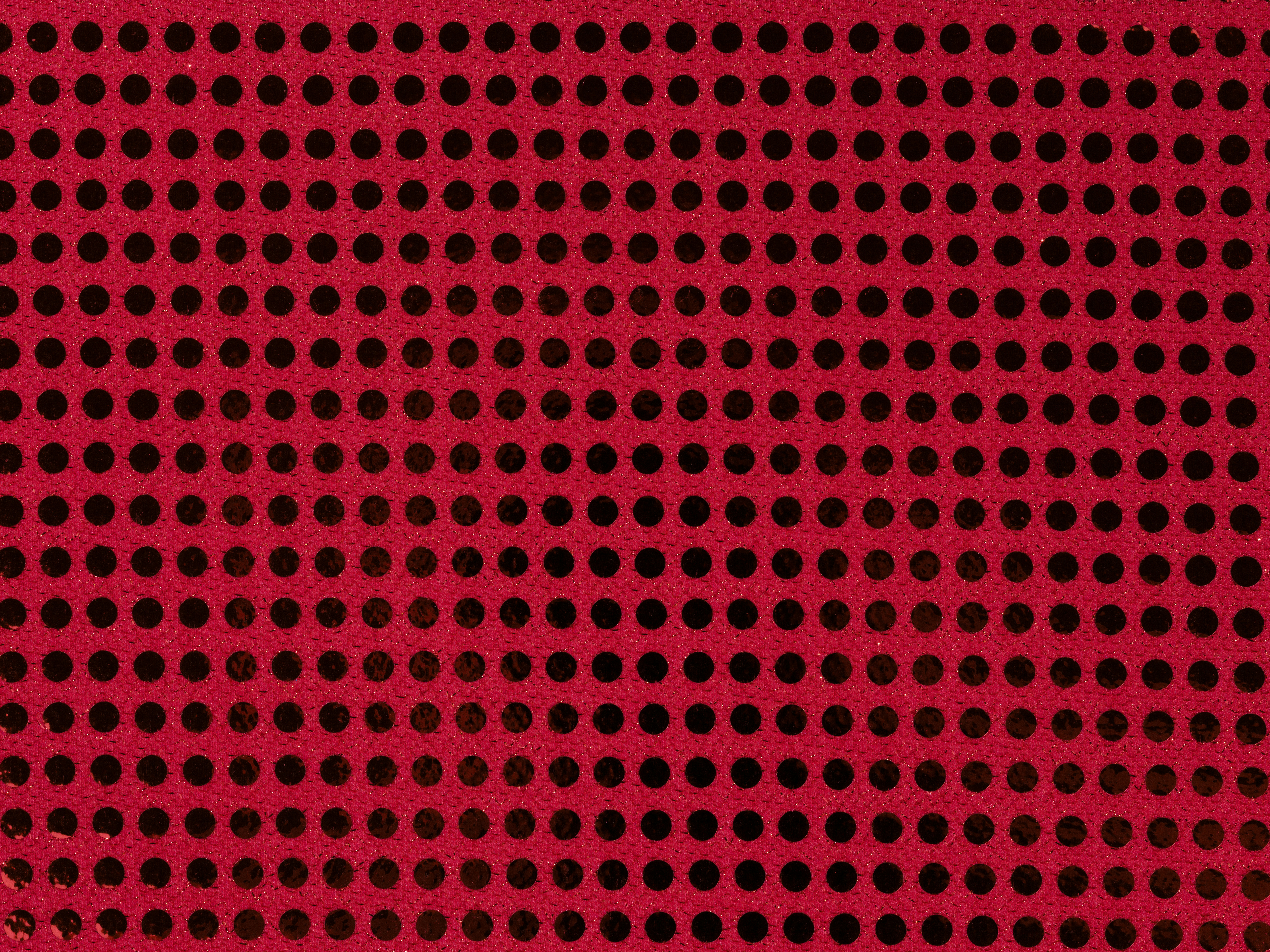a red background with black circles on it