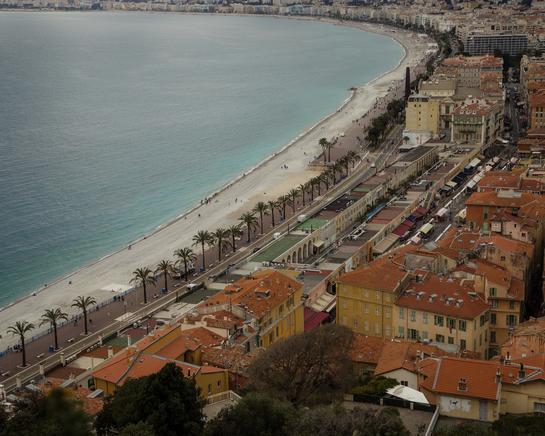The Baie des Anges, Promenade des Anglais and ochre rooftops of Nice seen from Castle Hill