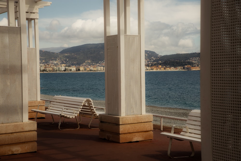 a couple of benches sitting on top of a pier