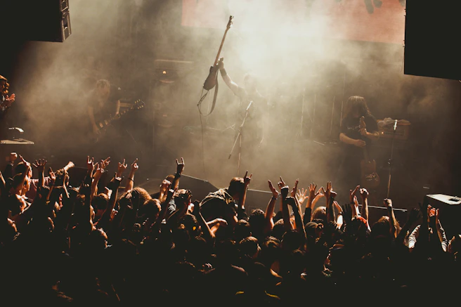 a group of people that are standing in front of a stage