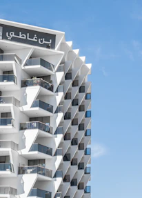 Modern residential building facade in Al Madinah with clear blue sky