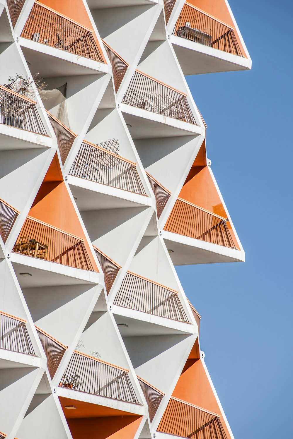 a very tall building with many balconies on it