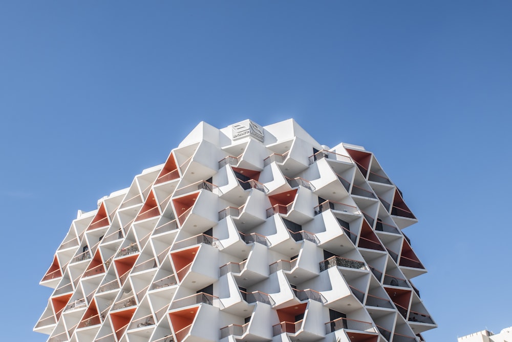 a very tall building with many windows and balconies