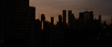 A city skyline at dusk symbolizing economic growth.