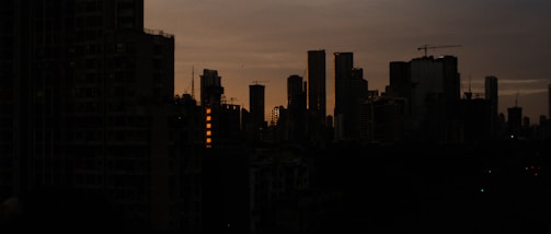 City skyline at dusk highlighting economic development.