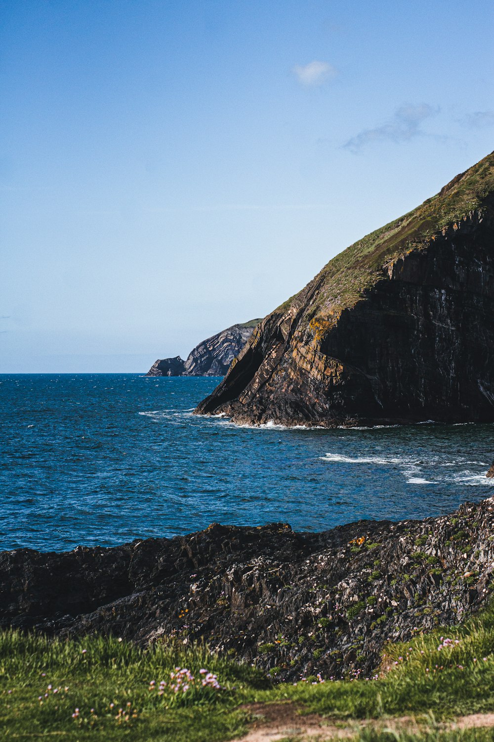 a man riding a surfboard on top of a body of water