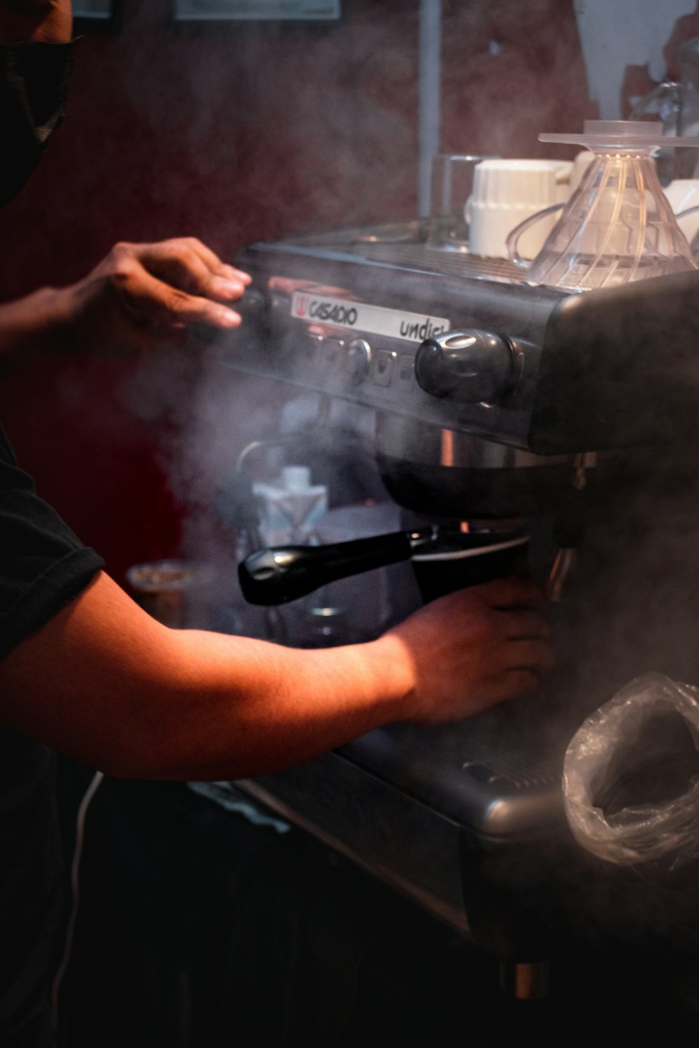 a person is working on a coffee machine