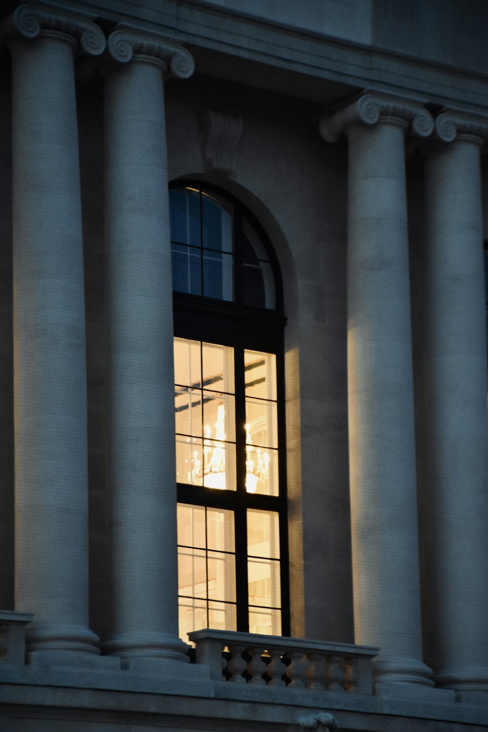 a large building with columns and a window