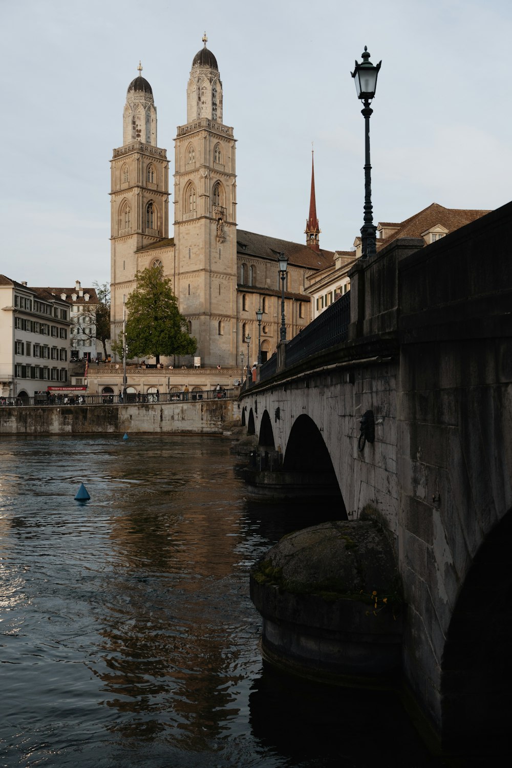 a river running through a city next to tall buildings