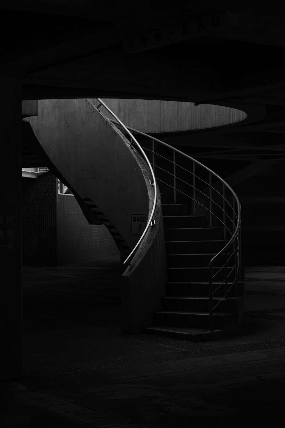 a black and white photo of a staircase