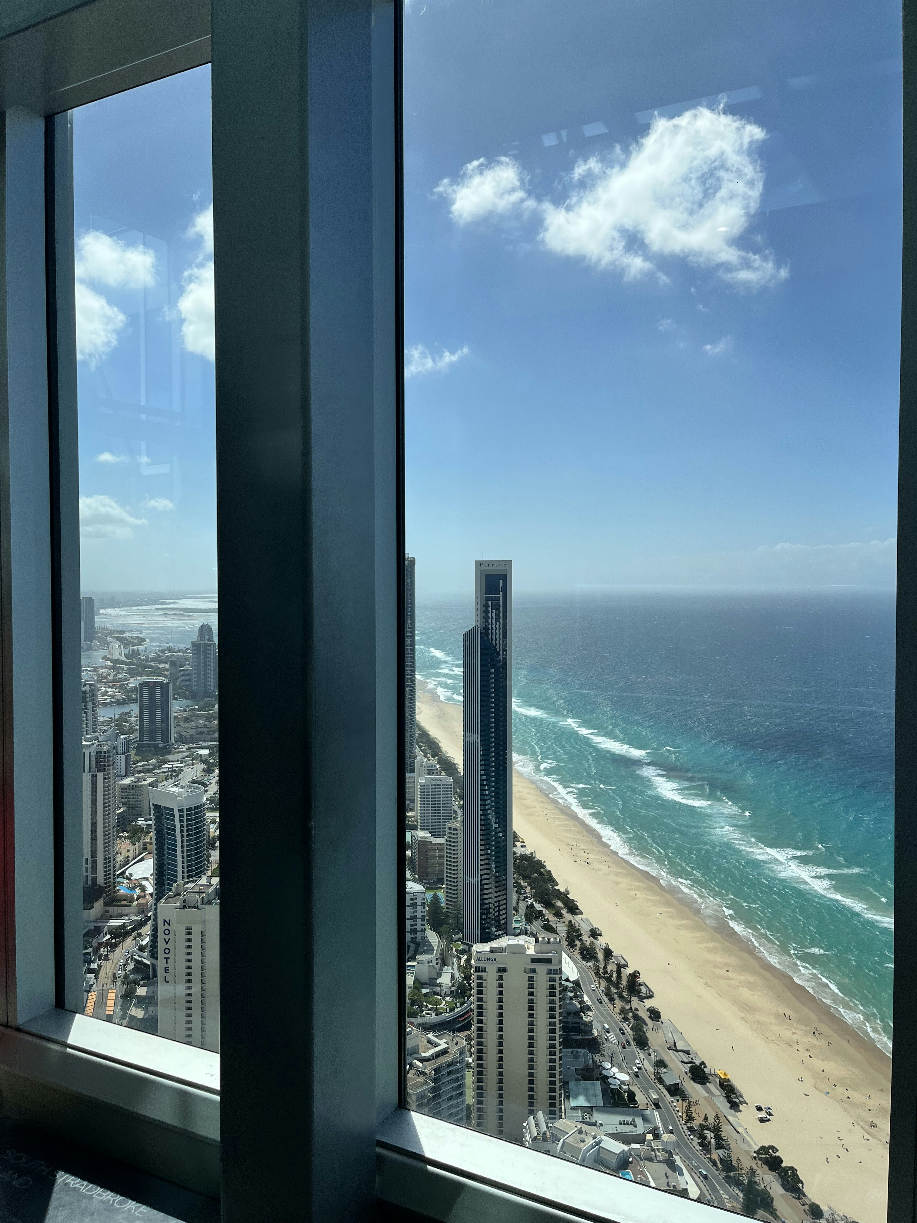 a view of a beach from a high rise window
