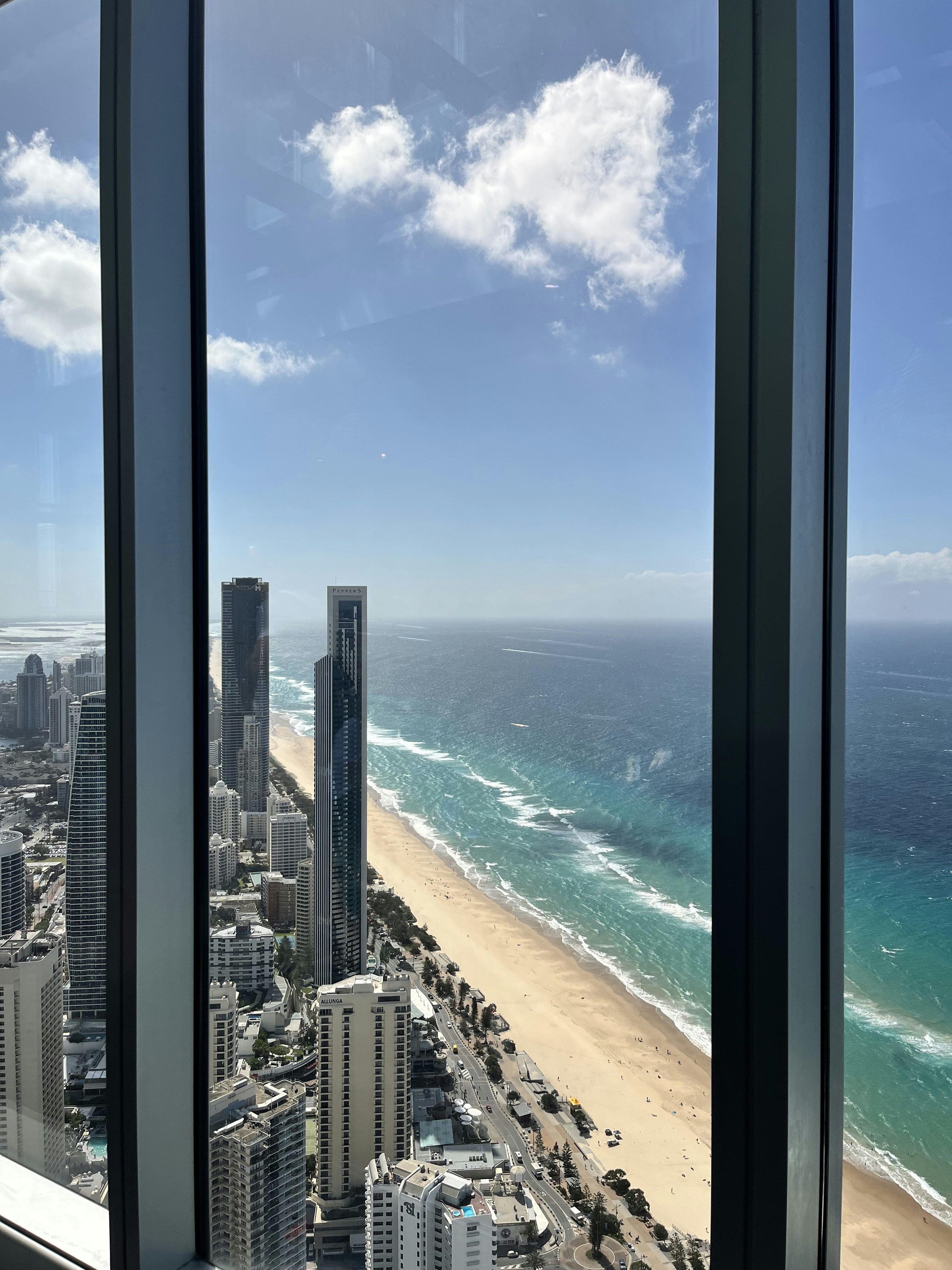 a view of a beach from a high rise window