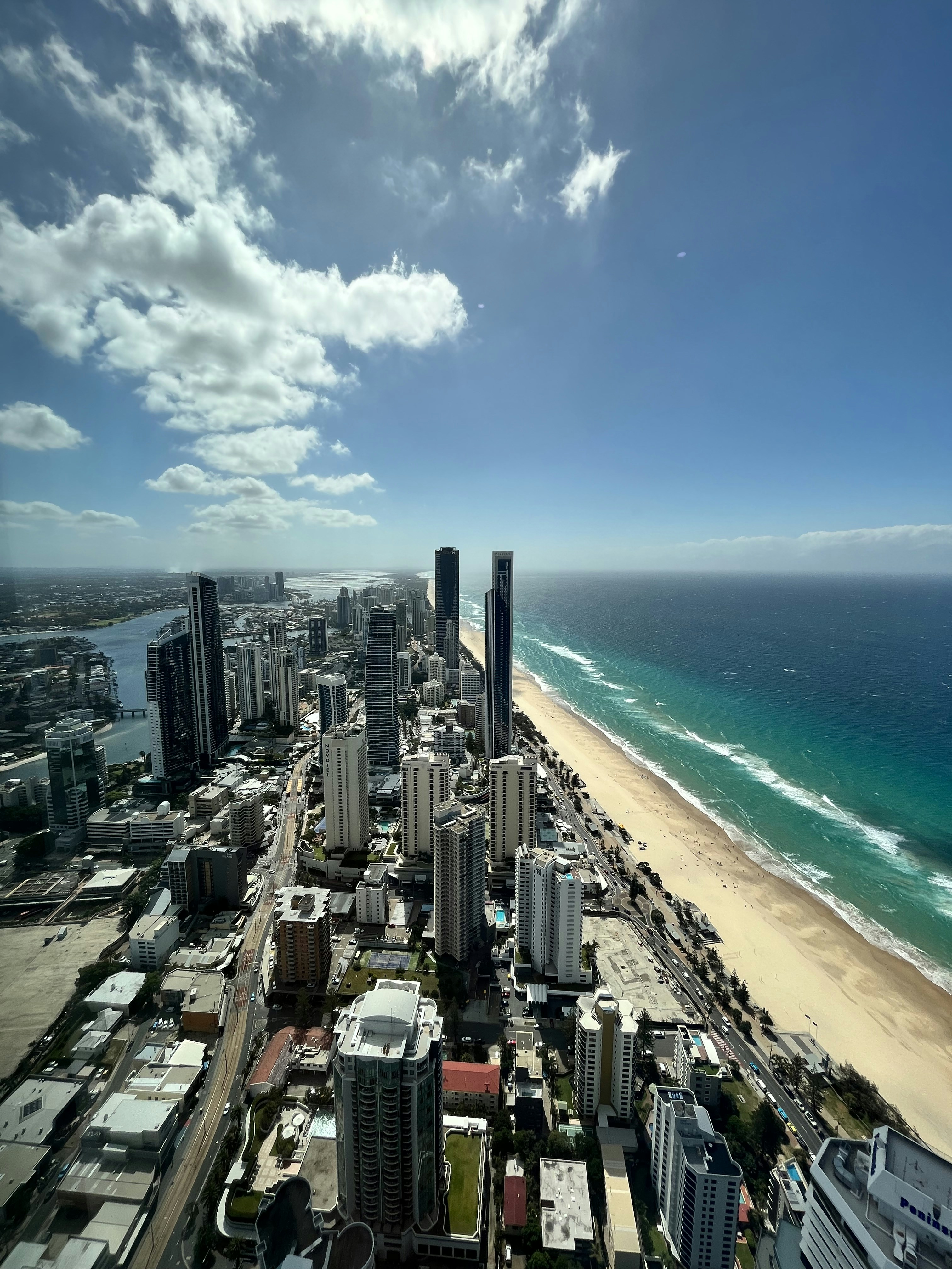 an aerial view of a city and the ocean