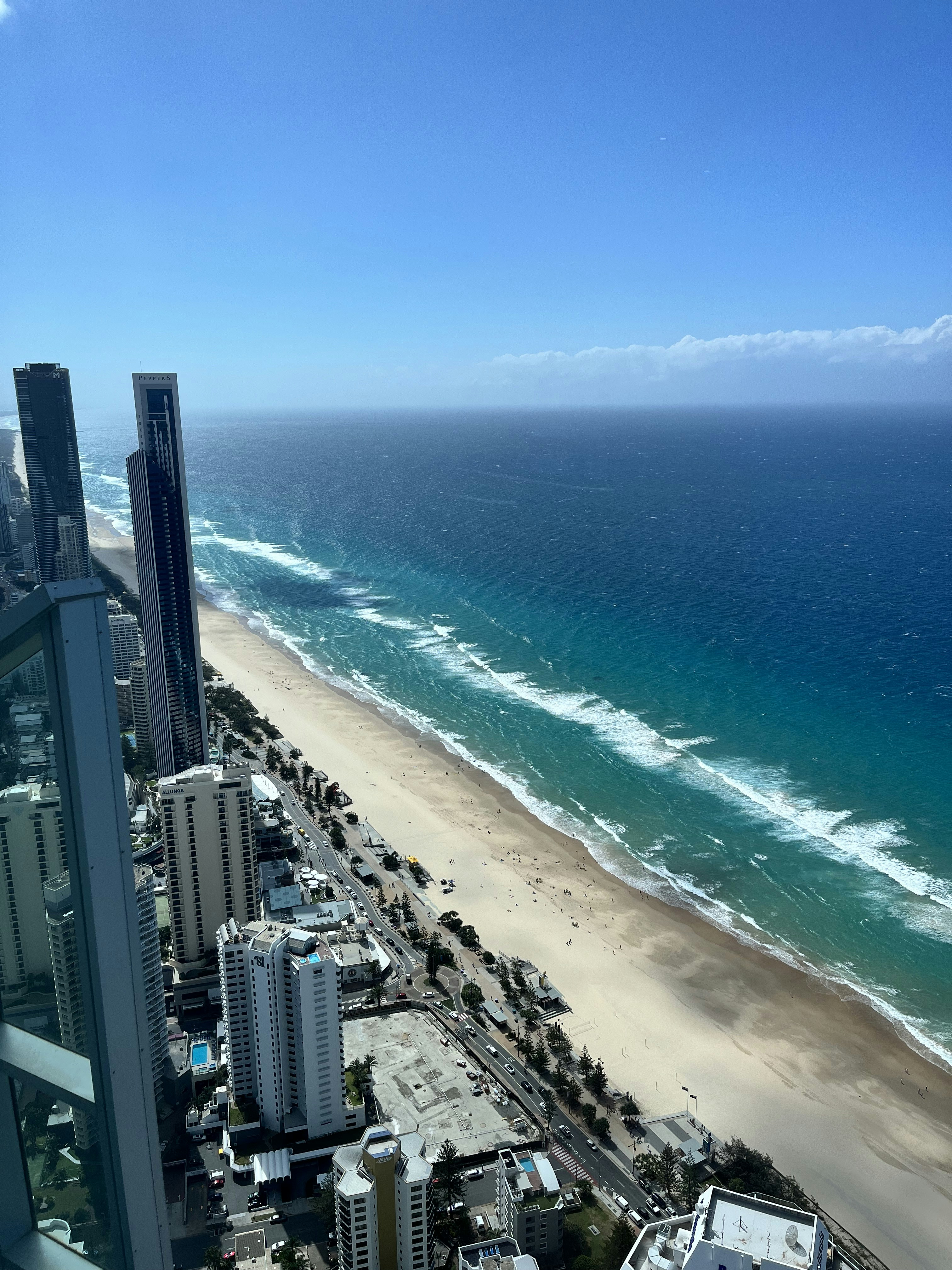 A view of a beach from a high rise building photo – Free Building Image ...