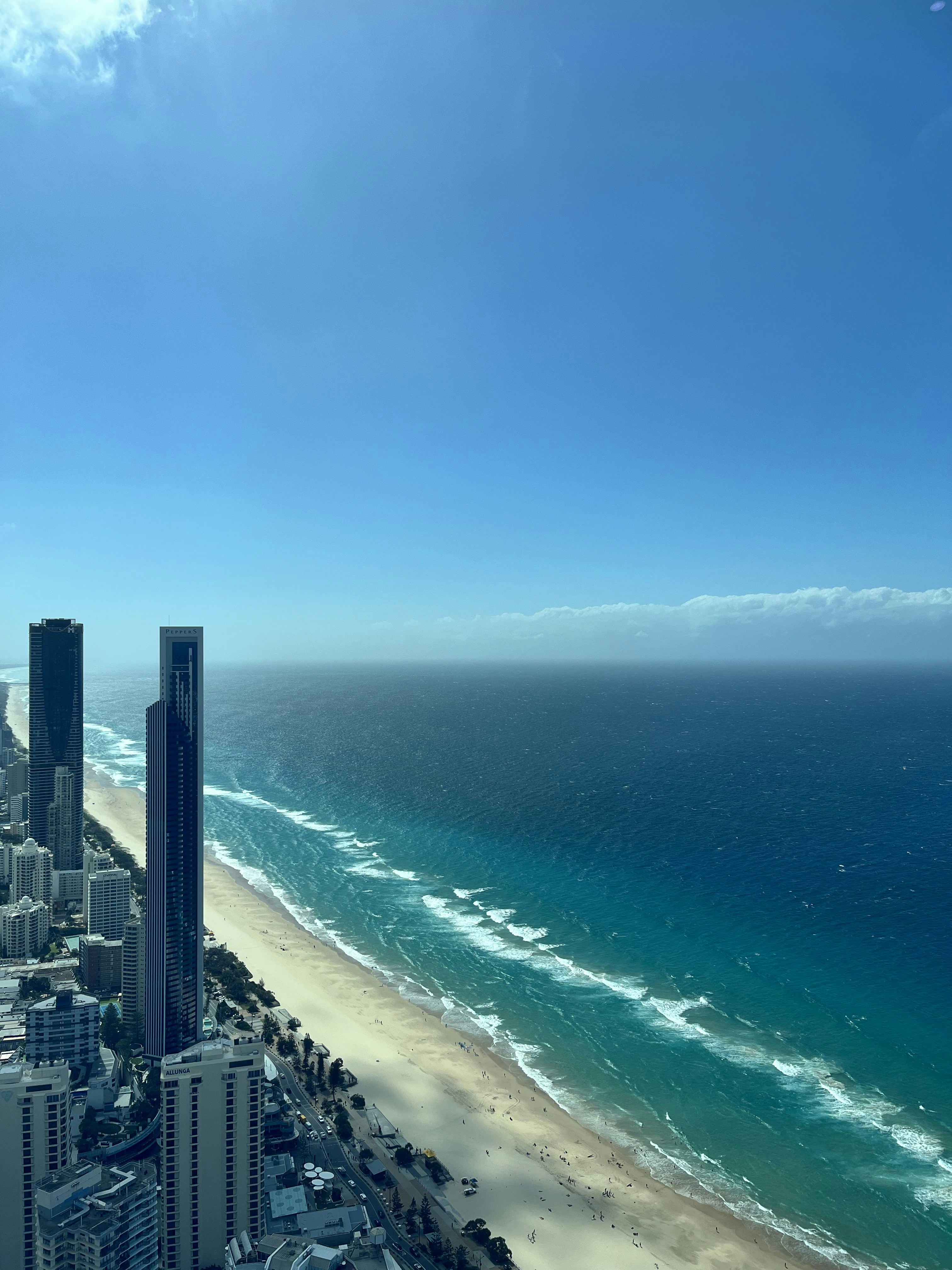 an aerial view of a city and the ocean