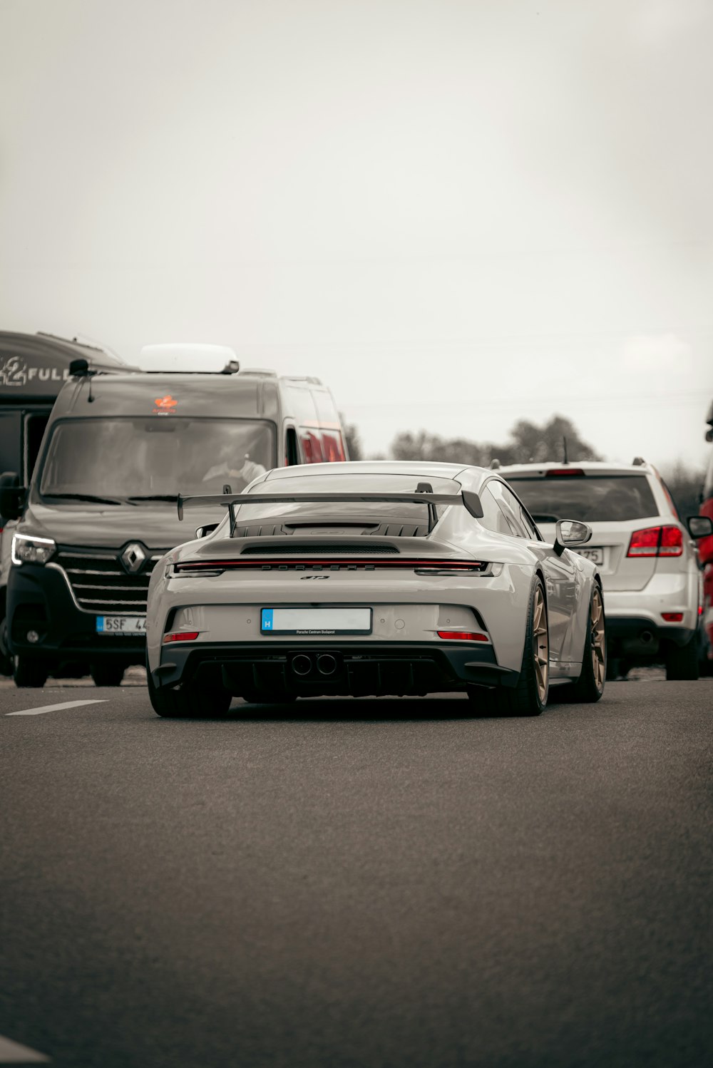 a group of cars that are sitting in the street