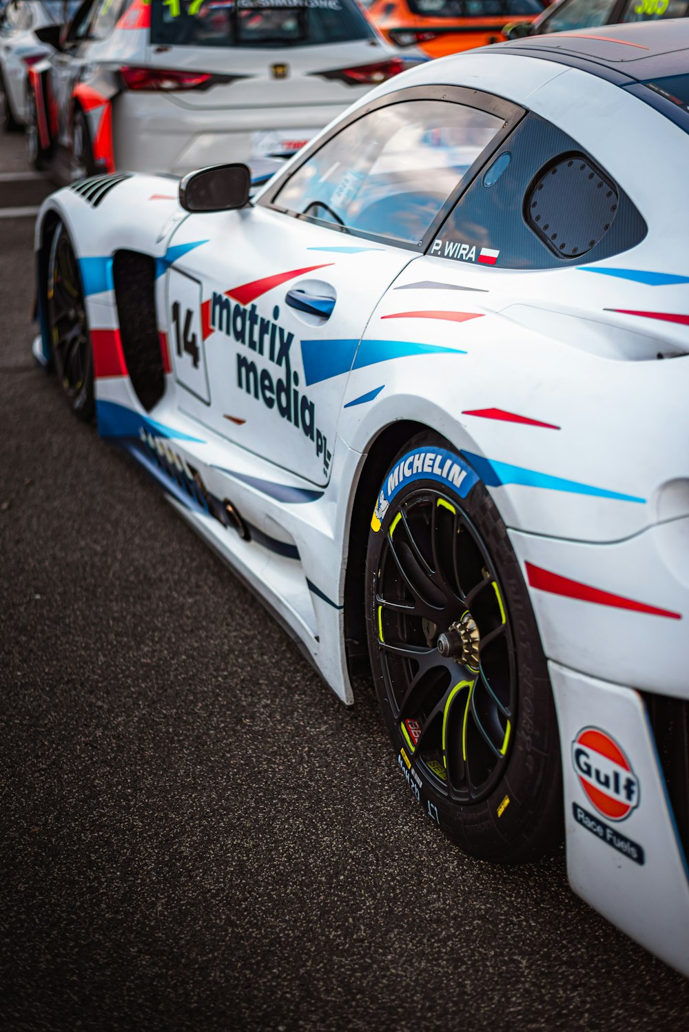 a close up of a racing car on a race track